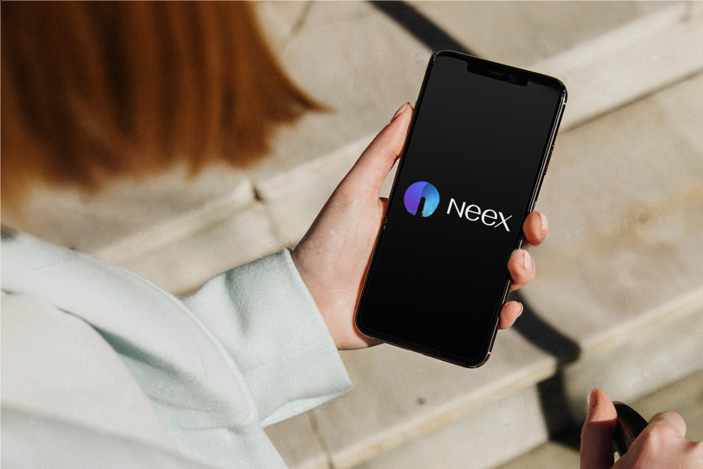 Girl using phone having Neex logo